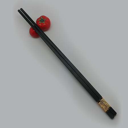 tomato with chopstick